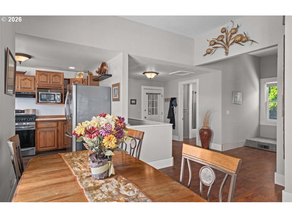 406 West C Street Rainier, OR 97048 - Photo 19 of 48 a living room with furniture and a chandelier