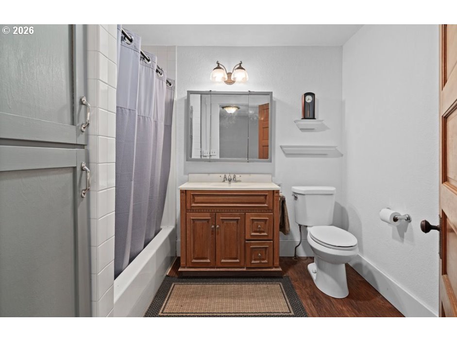 406 West C Street Rainier, OR 97048 - Photo 23 of 48 a bathroom with a sink a toilet and mirror