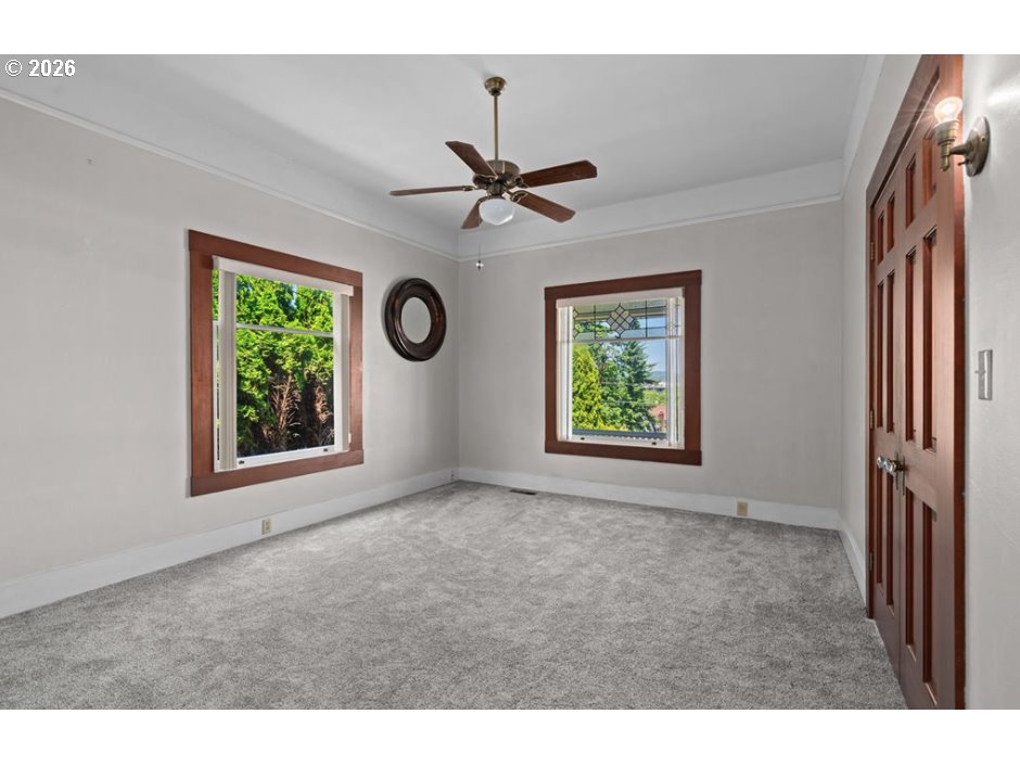 406 West C Street Rainier, OR 97048 - Photo 25 of 48 a view of an empty room with window and fan