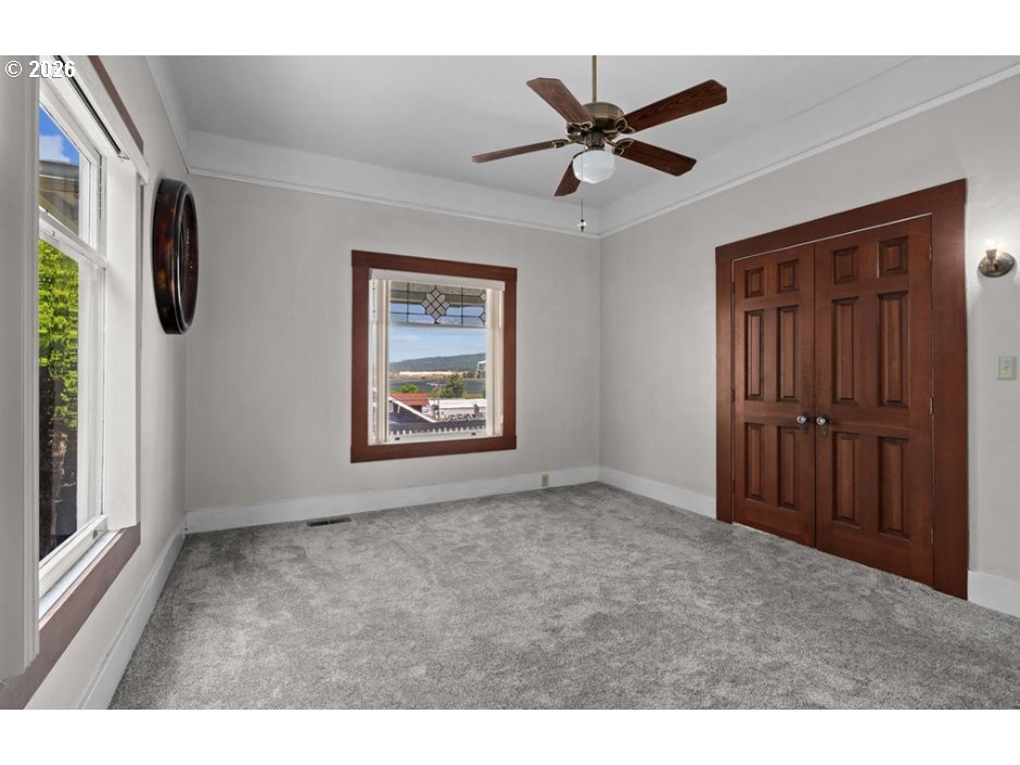 406 West C Street Rainier, OR 97048 - Photo 26 of 48 a view of a livingroom with a ceiling fan and window
