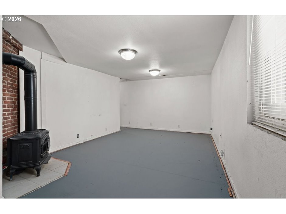 406 West C Street Rainier, OR 97048 - Photo 37 of 48 a view of an empty room with a window
