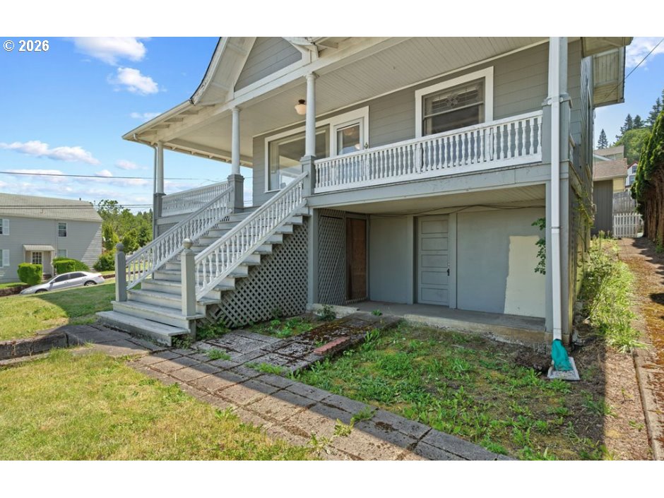 406 West C Street Rainier, OR 97048 - Photo 4 of 48 a view of a house with wooden walls and stairs