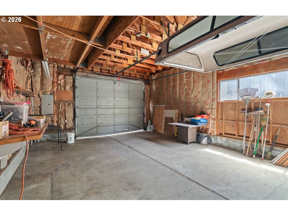 406 West C Street Rainier, OR 97048 - Photo 45 of 48 a view of a garage with parked cars