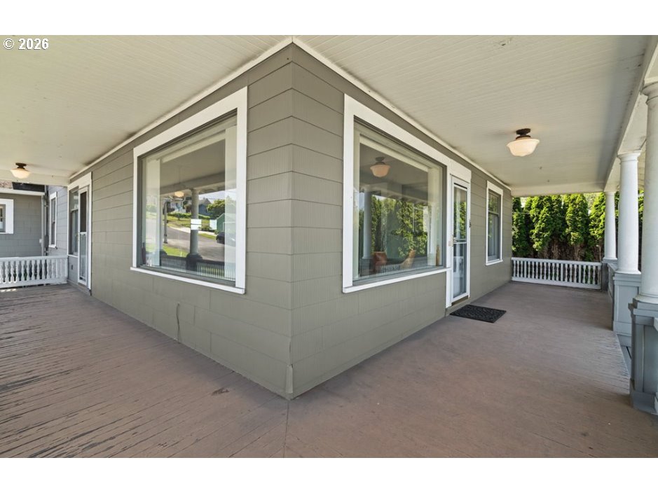 406 West C Street Rainier, OR 97048 - Photo 6 of 48 a view of an empty room with a window