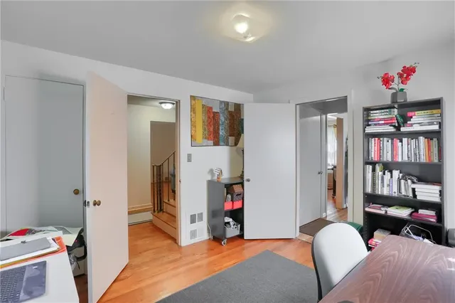 a bed room with a bed and a book shelf