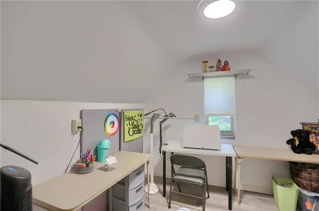 a workspace with furniture and window