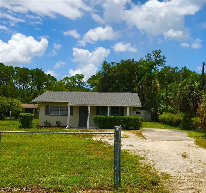 14640 Cemetery Road Fort Myers, FL 33905 - Photo 6 of 23 a front view of a house with a yard