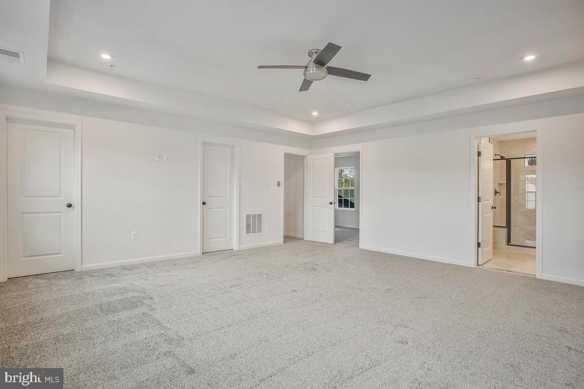6511 Suitland Road Suitland, MD 20746 - Photo 12 of 17 a view of an empty room with a ceiling fan