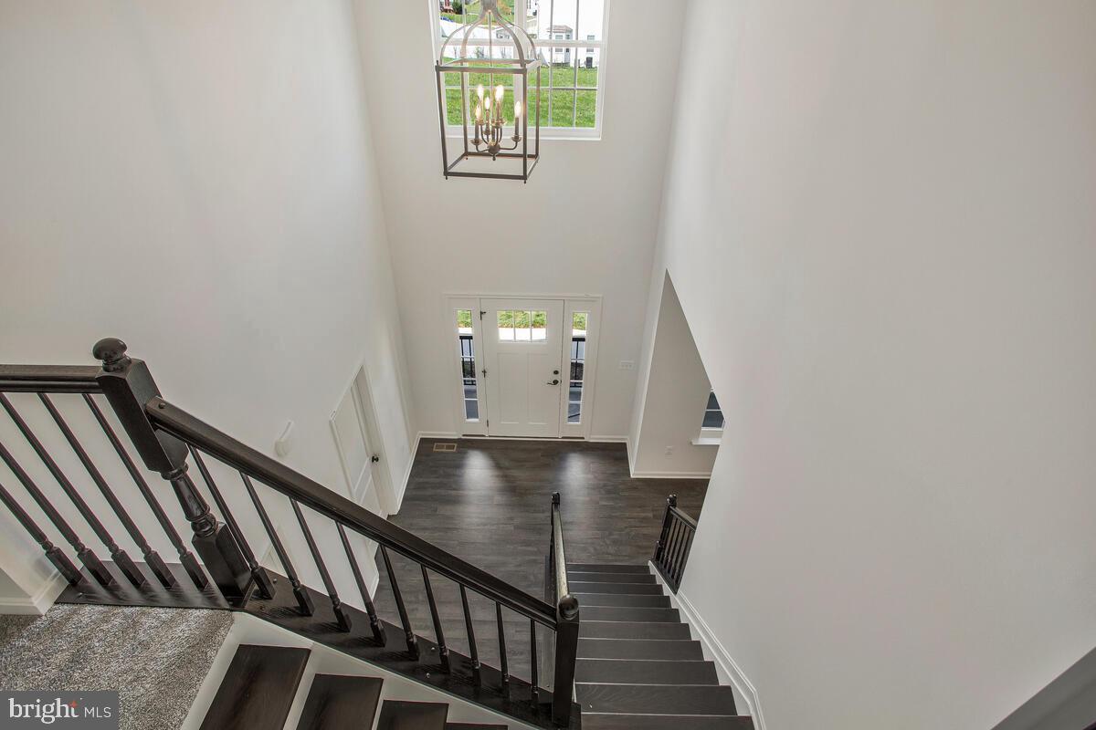 6511 Suitland Road Suitland, MD 20746 - Photo 2 of 17 a view of entryway and hall with wooden floor