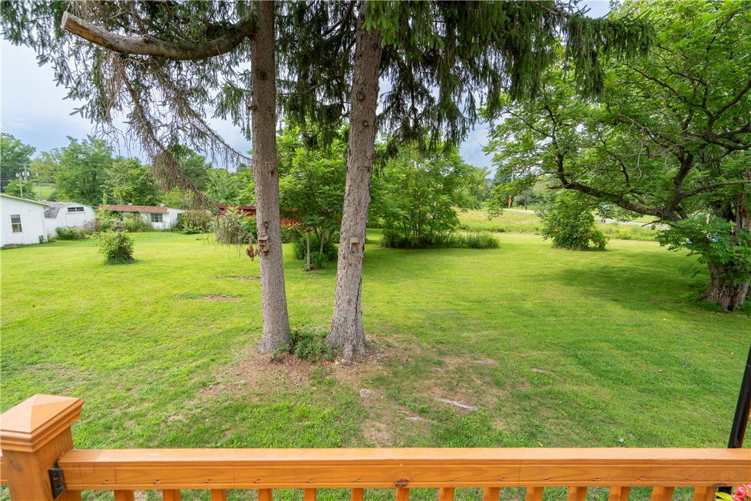 665 Point Phillips Road Bath, PA 18014 - Photo 49 of 73 A verdant, open yard with mature trees offers peaceful outdoor living space.