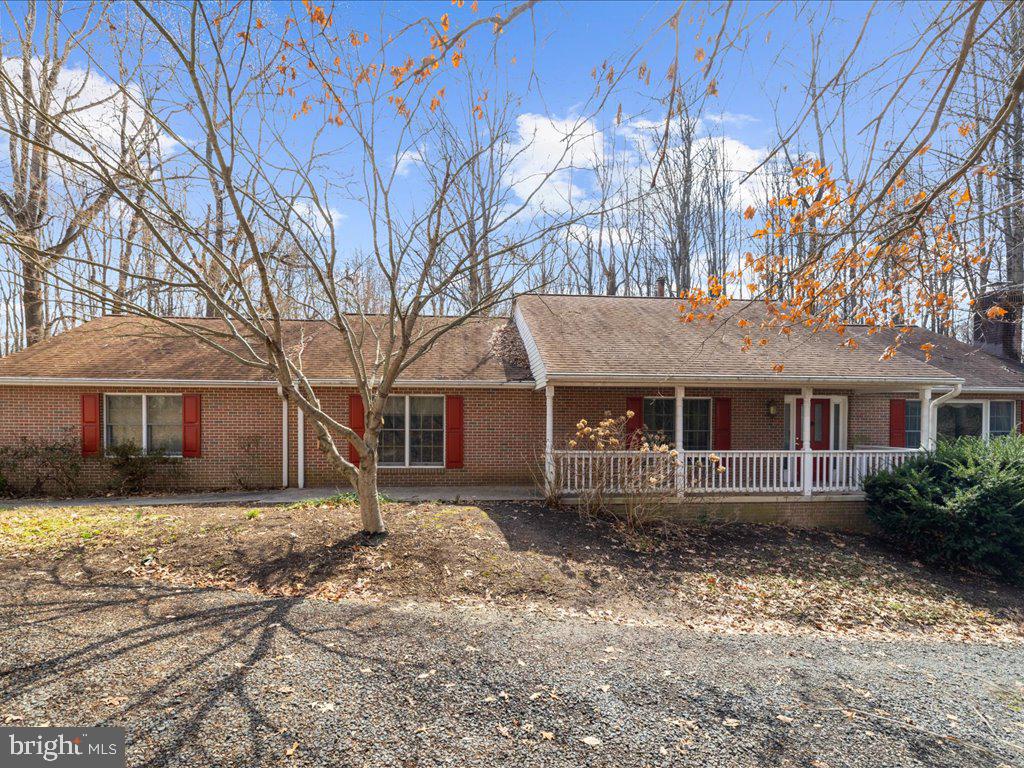 5789 Greenock Road Lothian, MD 20711 - Photo 2 of 57 a front view of a house with a yard