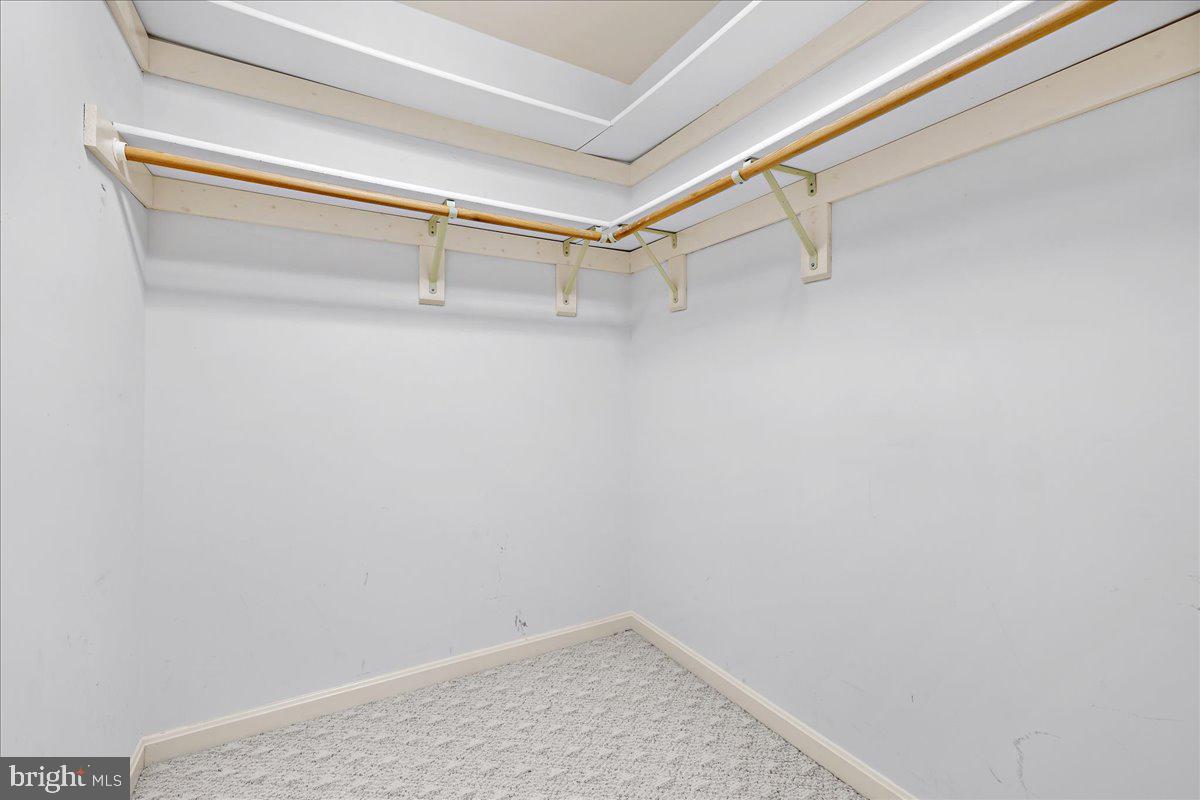 5789 Greenock Road Lothian, MD 20711 - Photo 25 of 57 a view of a room with racks on the wall