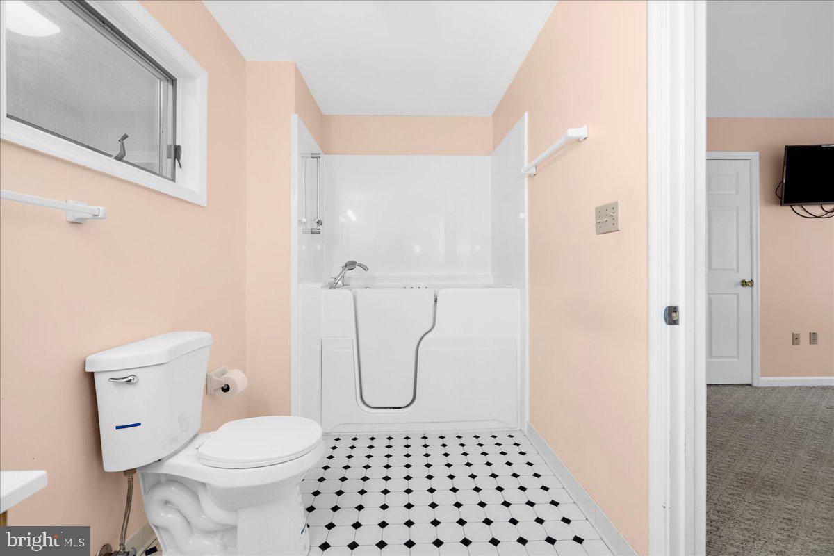 5789 Greenock Road Lothian, MD 20711 - Photo 27 of 57 a bathroom with a toilet a sink and a shower