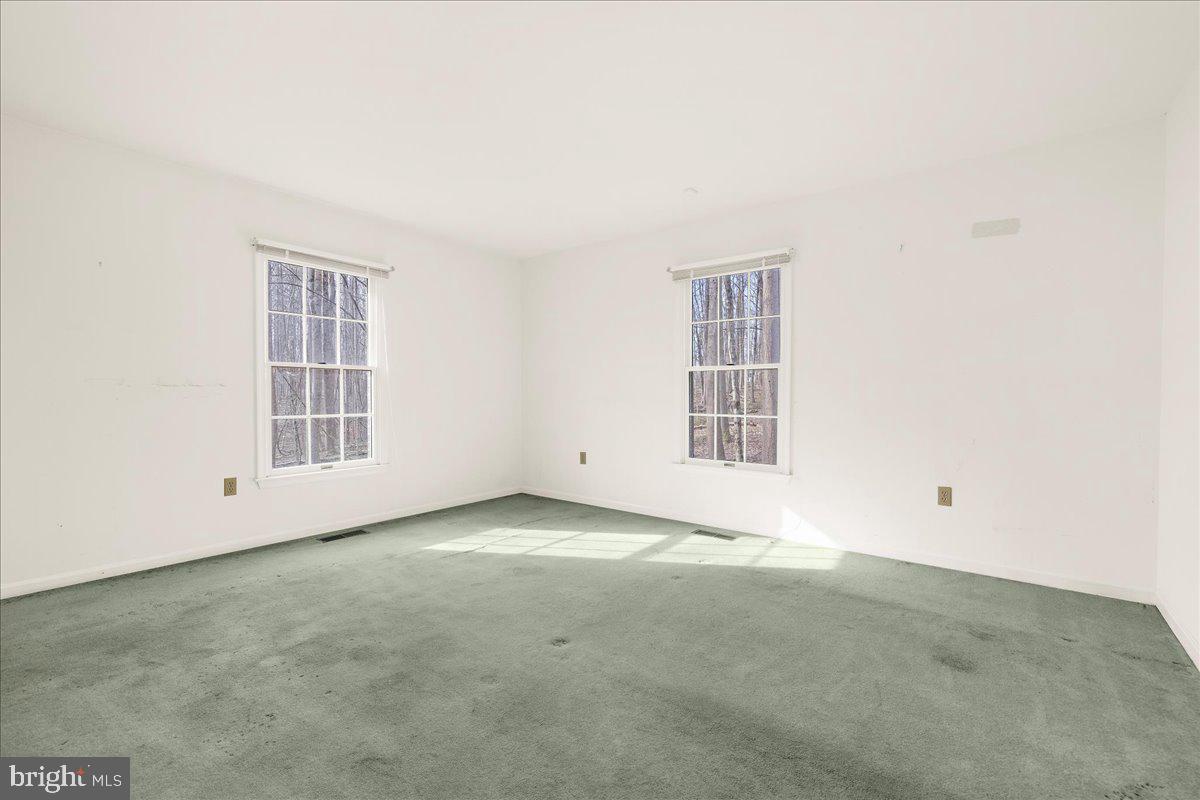 5789 Greenock Road Lothian, MD 20711 - Photo 29 of 57 an empty room with windows