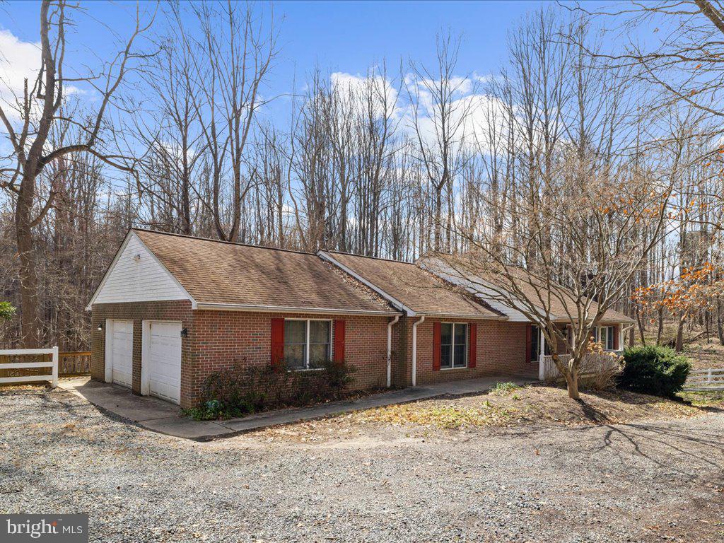 5789 Greenock Road Lothian, MD 20711 - Photo 3 of 57 a front view of a house with a yard