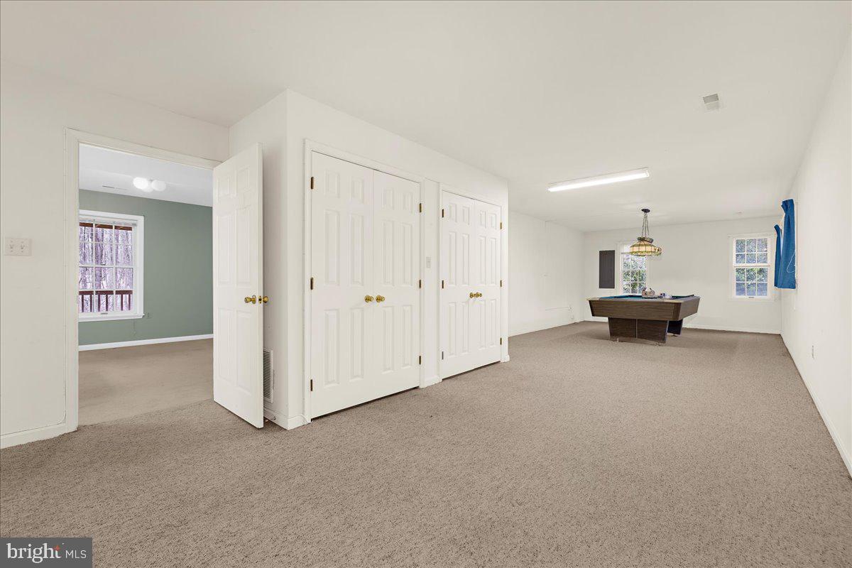 5789 Greenock Road Lothian, MD 20711 - Photo 33 of 57 a view of a livingroom with a chandelier