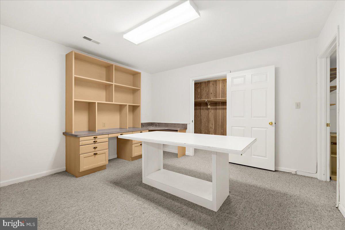 5789 Greenock Road Lothian, MD 20711 - Photo 34 of 57 a kitchen with a sink a stove a refrigerator and white cabinets