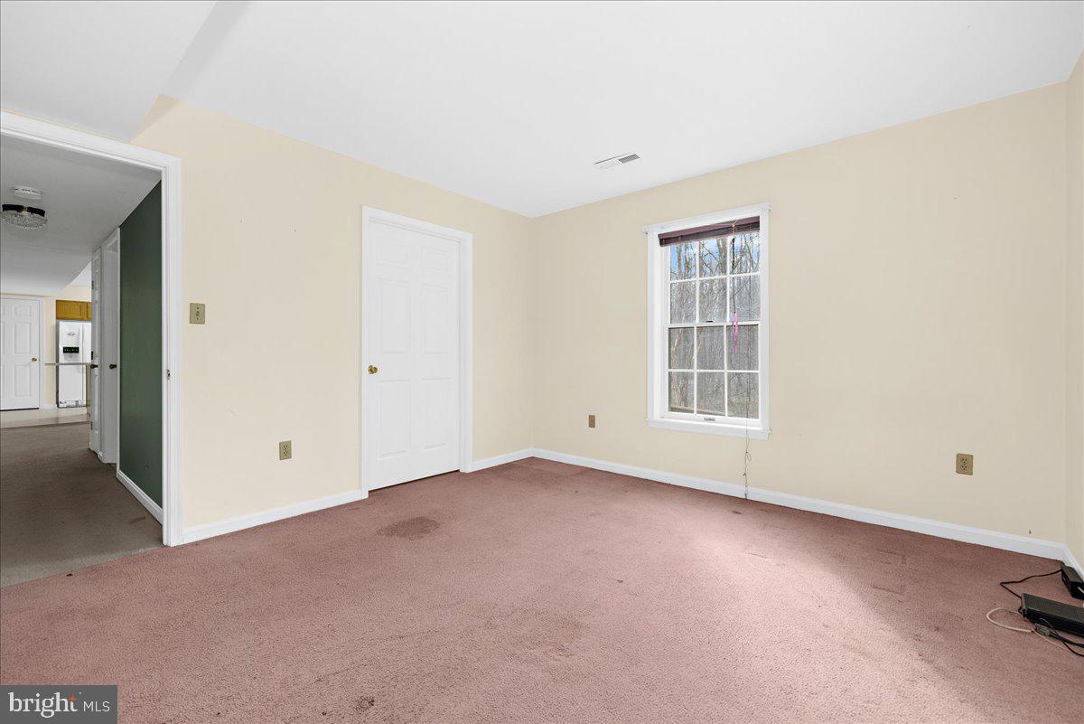 5789 Greenock Road Lothian, MD 20711 - Photo 48 of 57 an empty room with windows