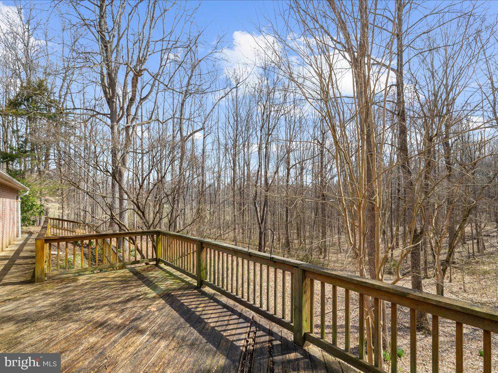 5789 Greenock Road Lothian, MD 20711 - Photo 52 of 57 a view of balcony with wooden floor