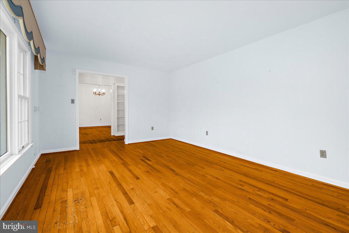 5789 Greenock Road Lothian, MD 20711 - Photo 8 of 57 a bedroom with a bed and wooden floor