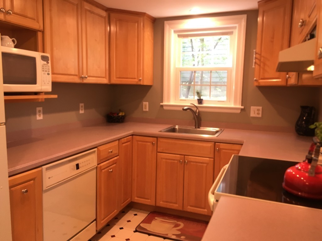 12 Kent Road Needham, MA 02492 - Photo 10 of 20 a kitchen with stainless steel appliances a sink a stove and a microwave