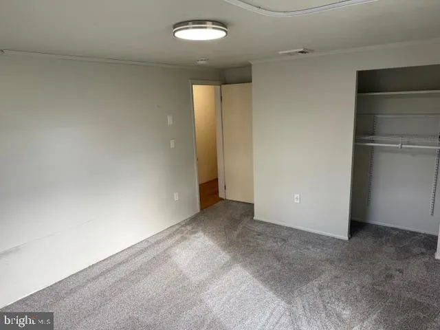 a bathroom with a sink a toilet a mirror and window