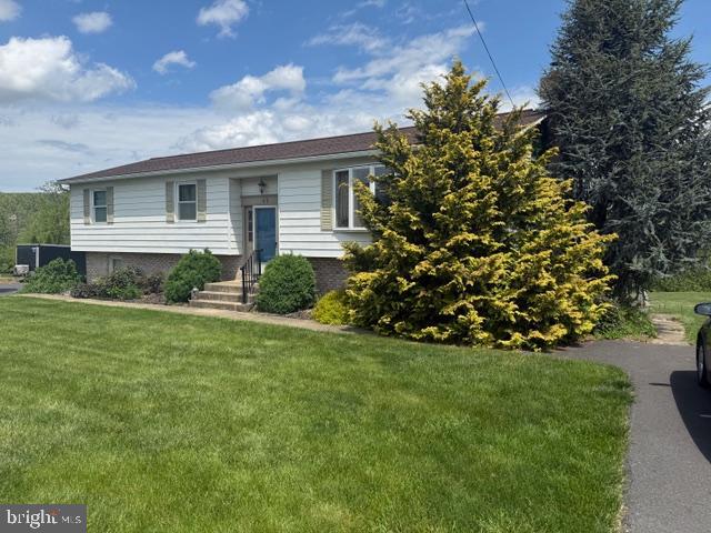 65 Campbell Road York, PA 17406 - Photo 2 of 61 a front view of a house with garden