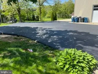 a view of a field with an ocean