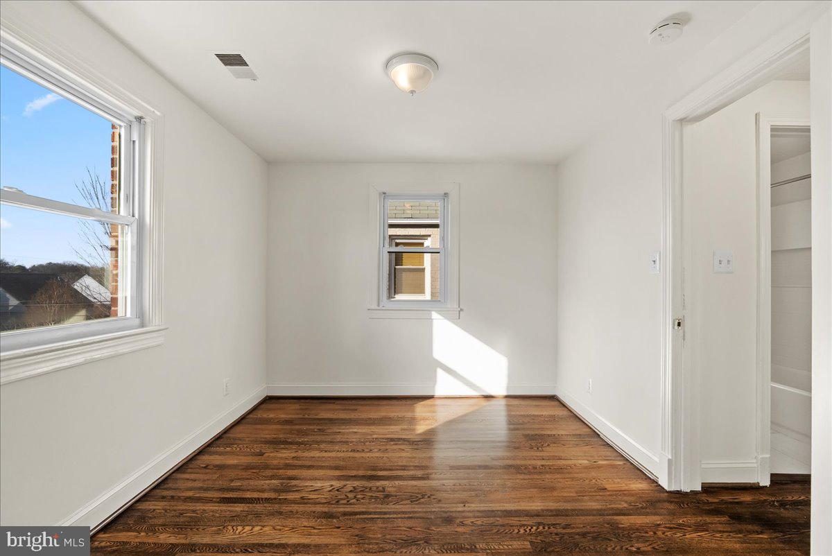 6416 Blair Road Northwest Washington, DC 20012 - Photo 15 of 32 a view of empty room with wooden floor and fan