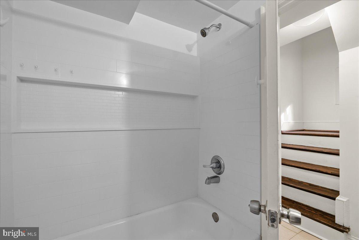 6416 Blair Road Northwest Washington, DC 20012 - Photo 24 of 32 a bathroom with a bathtub