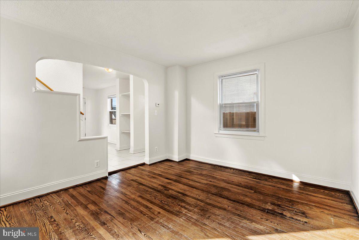 6416 Blair Road Northwest Washington, DC 20012 - Photo 5 of 32 a view of a livingroom with wooden floor and a window