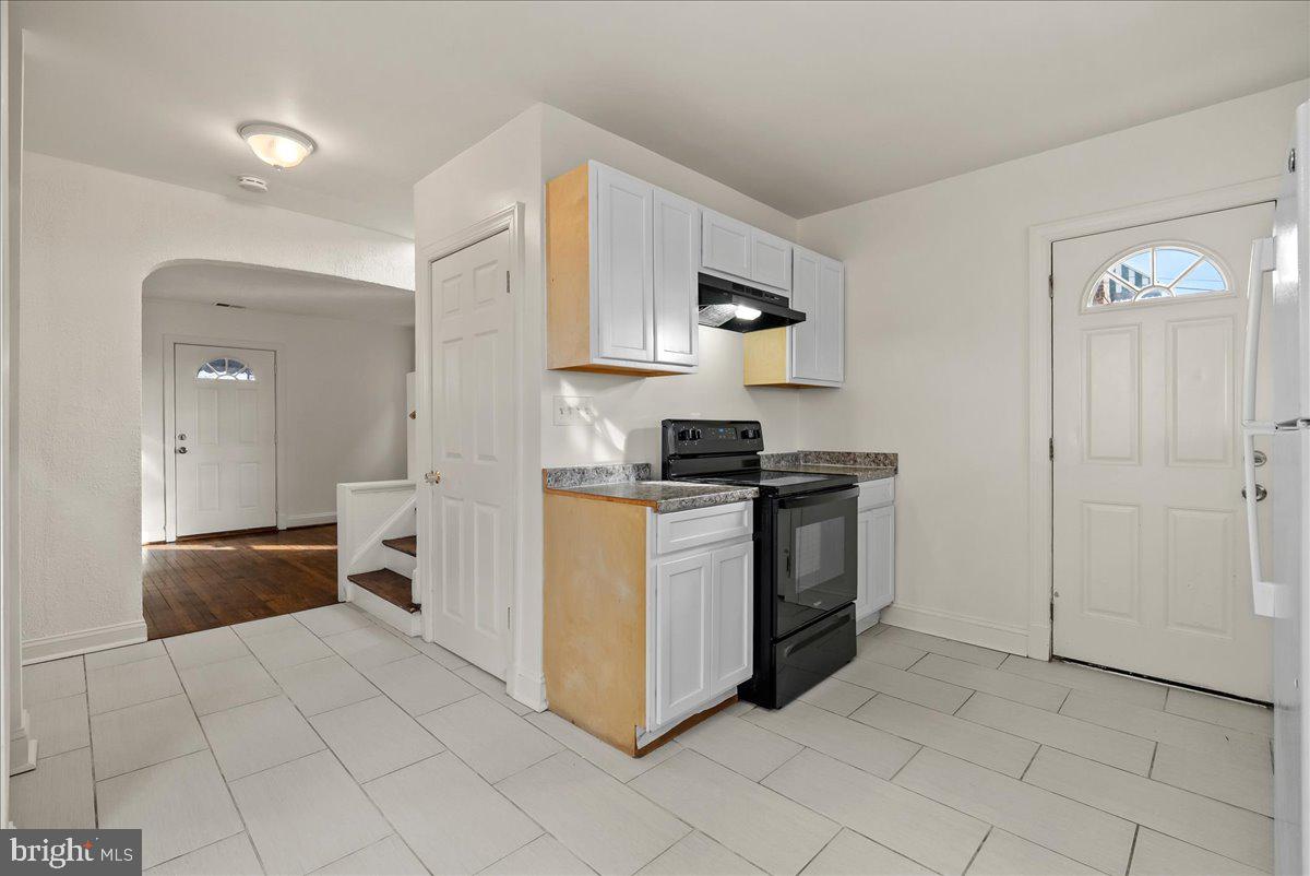 6416 Blair Road Northwest Washington, DC 20012 - Photo 8 of 32 a kitchen with stainless steel appliances a sink and a refrigerator