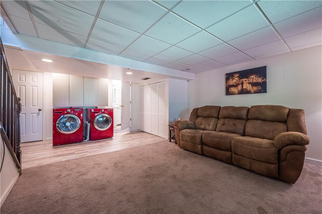 336 Duff Road Sewickley, PA 15143 - Photo 29 of 50 Netflix and laundry in this comfortable family room with direct access to the lower deck