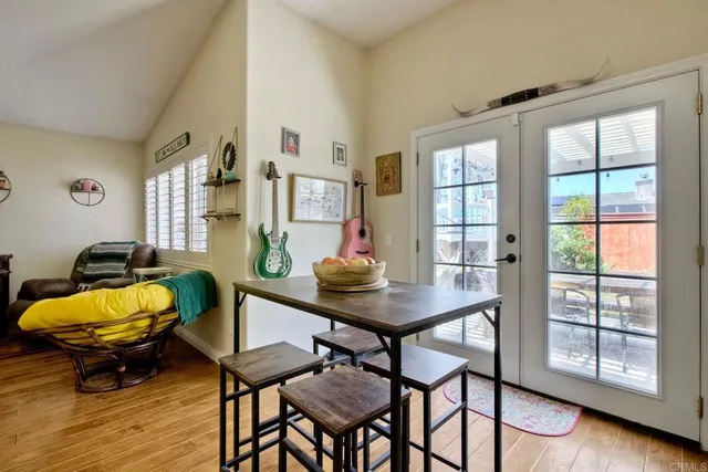 a view of a room that has a table and chairs