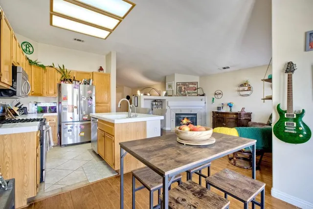 a open kitchen with a table and chairs in it