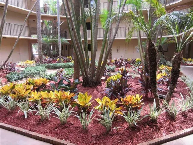 a view of a fountain in front of a house