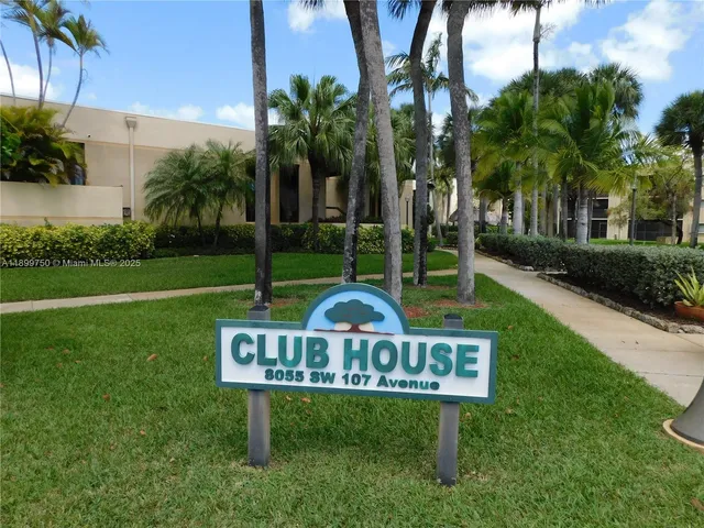 a view of a garden with a bench in patio