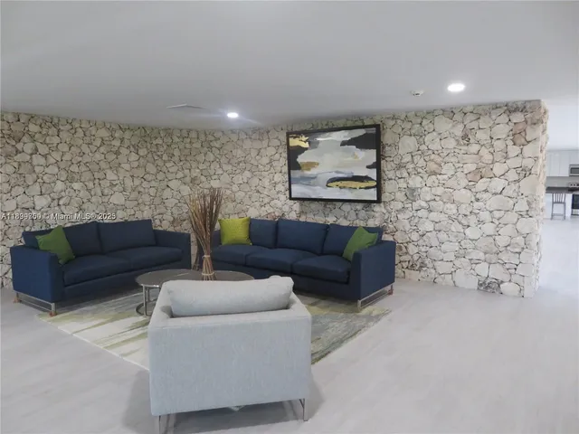 a living room with furniture and a rug