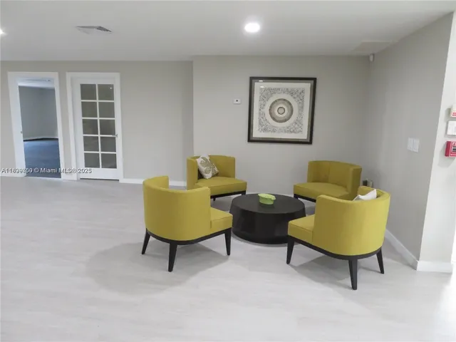 a kitchen with stainless steel appliances granite countertop a stove a microwave and cabinets