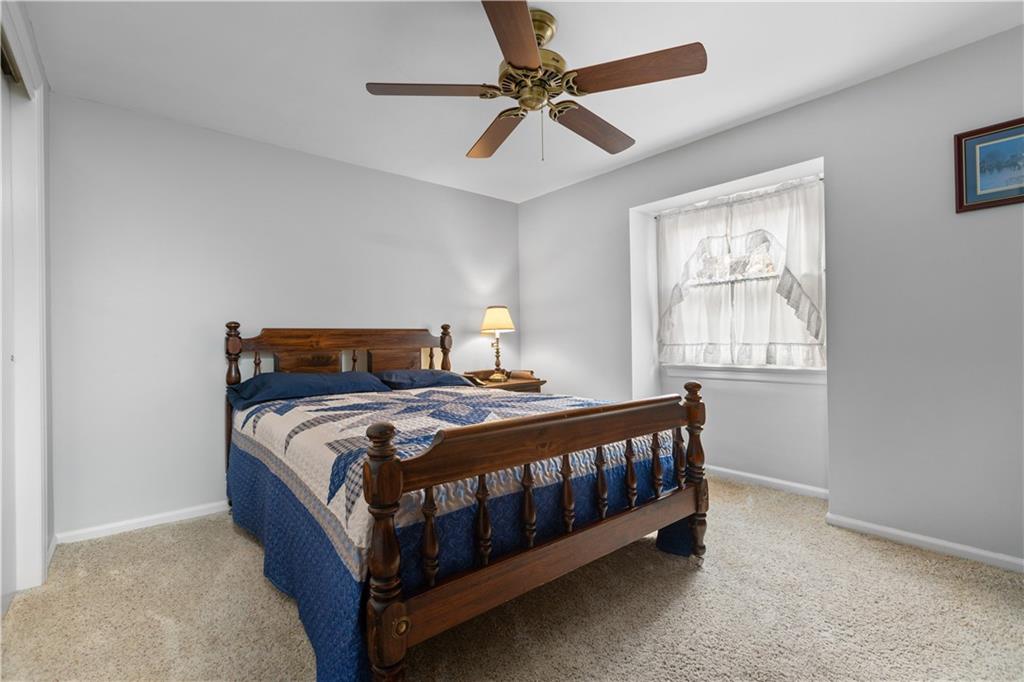 5895 Tuscarawas Road Beaver, PA 15009 - Photo 17 of 23 a bedroom with a bed and window