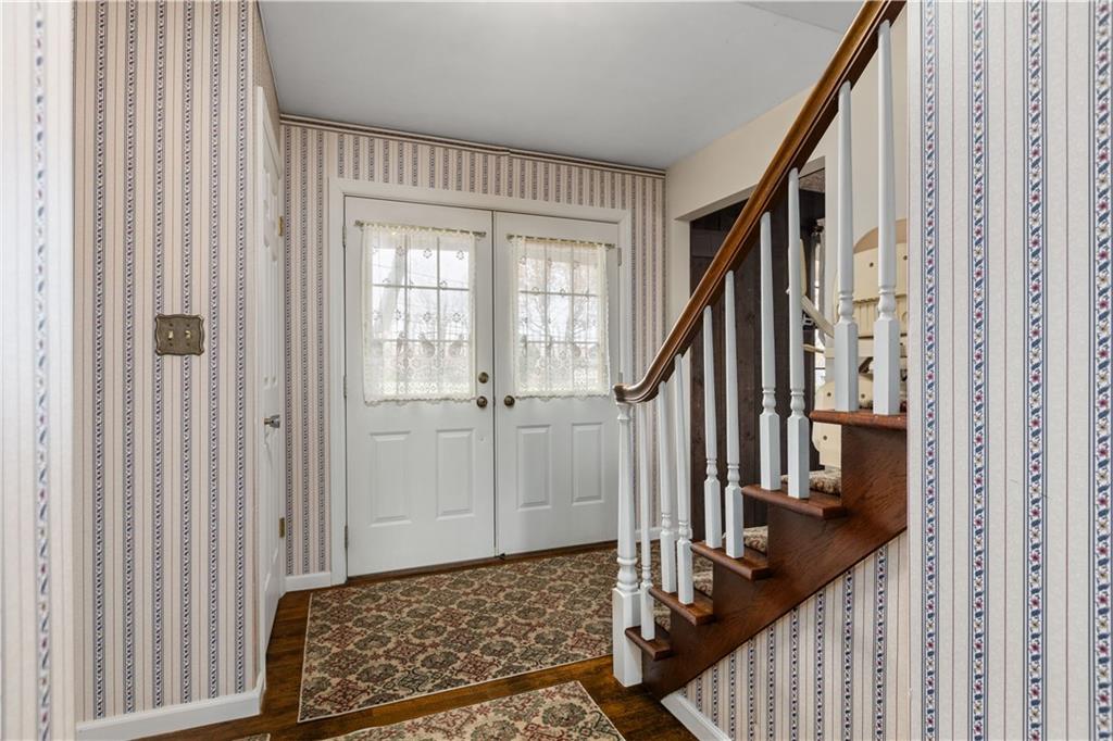 5895 Tuscarawas Road Beaver, PA 15009 - Photo 5 of 23 a view of a hallway with wooden floor and stairs