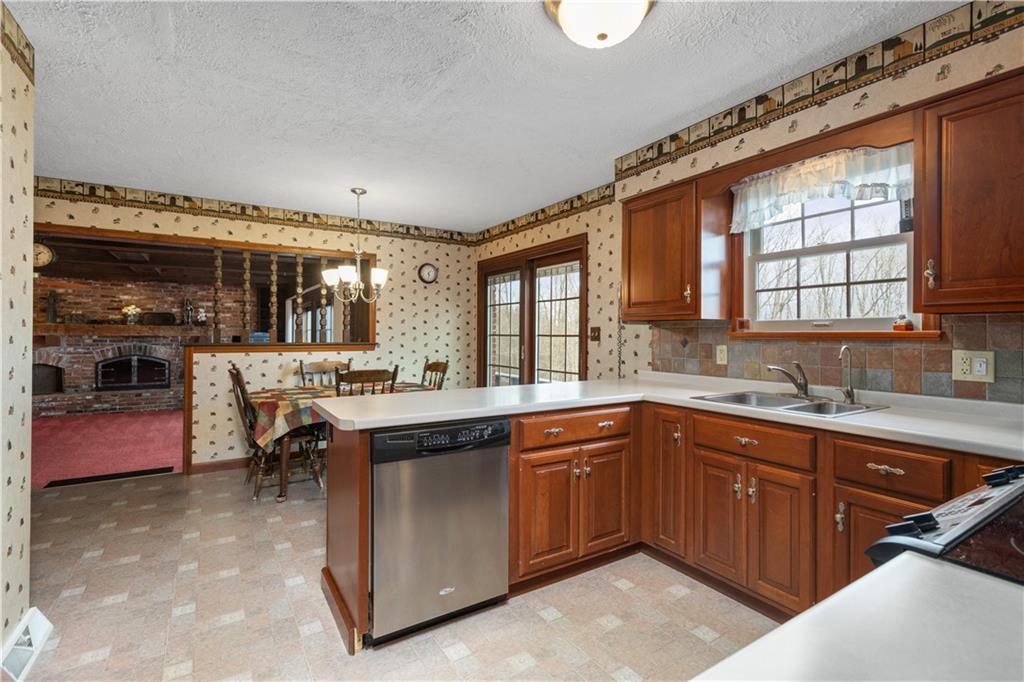 5895 Tuscarawas Road Beaver, PA 15009 - Photo 7 of 23 a kitchen with a sink counter top space and appliances