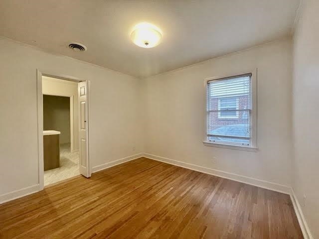 4691 Lynn Road Memphis, TN 38122 - Photo 9 of 12 a view of an empty room with wooden floor and a window
