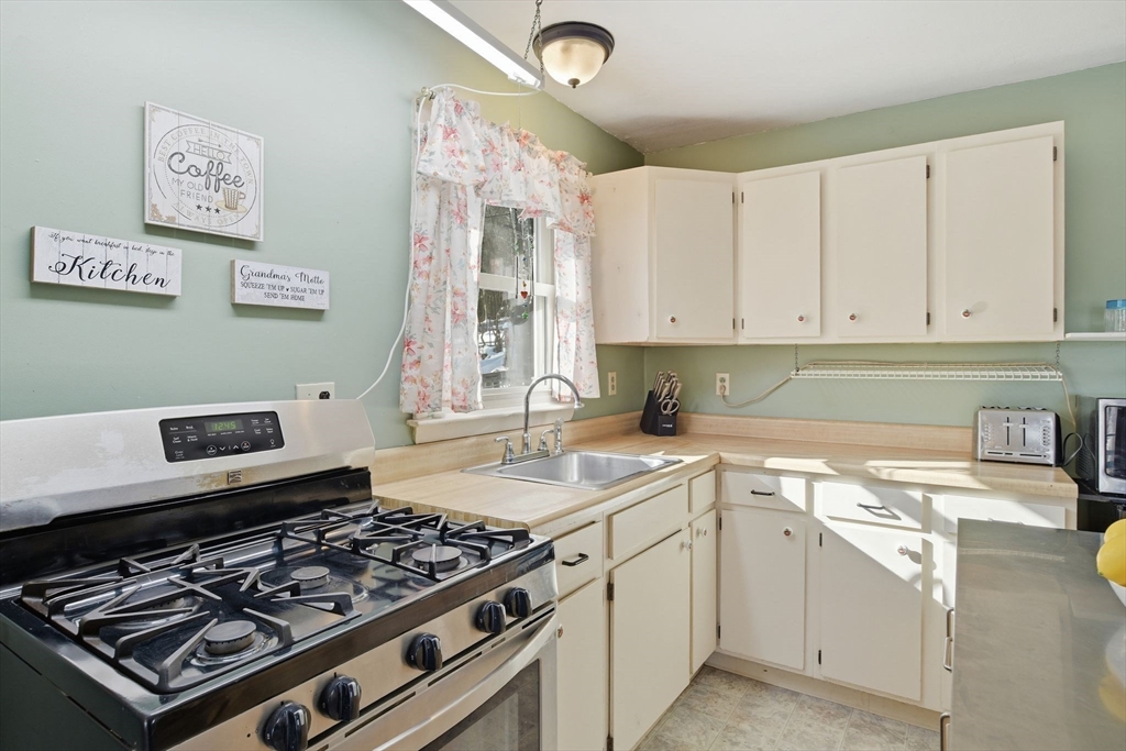 200 Fox Den Road Tolland, MA 01034 - Photo 14 of 37 a kitchen with a stove and a sink