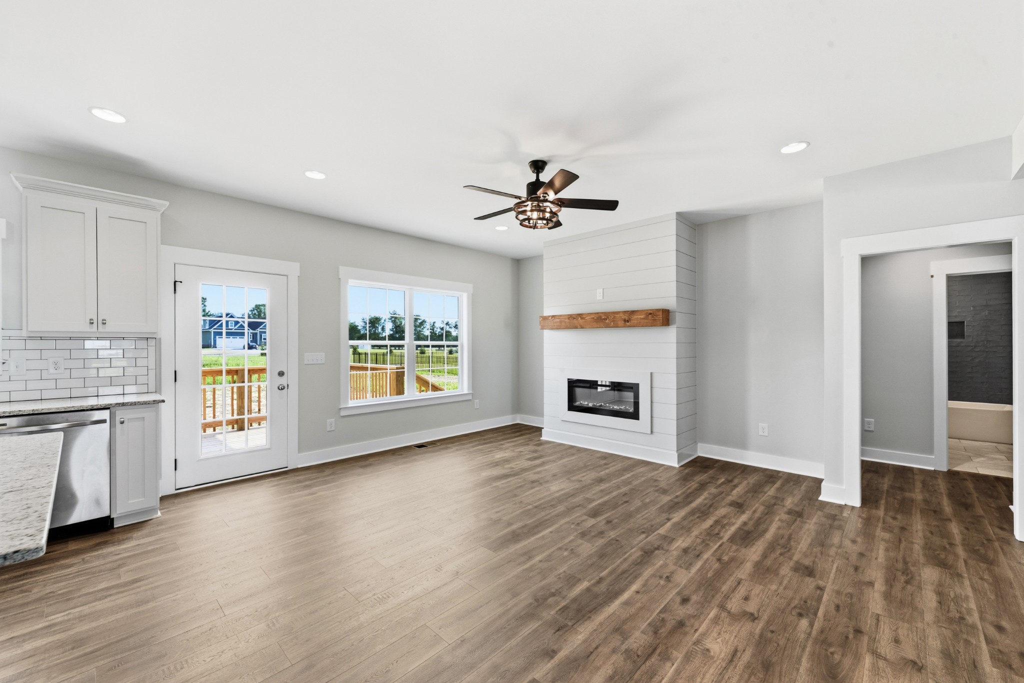 338 Dugout Road Summertown, TN 38483 - Photo 19 of 75 a view of an empty room with a fireplace and a window