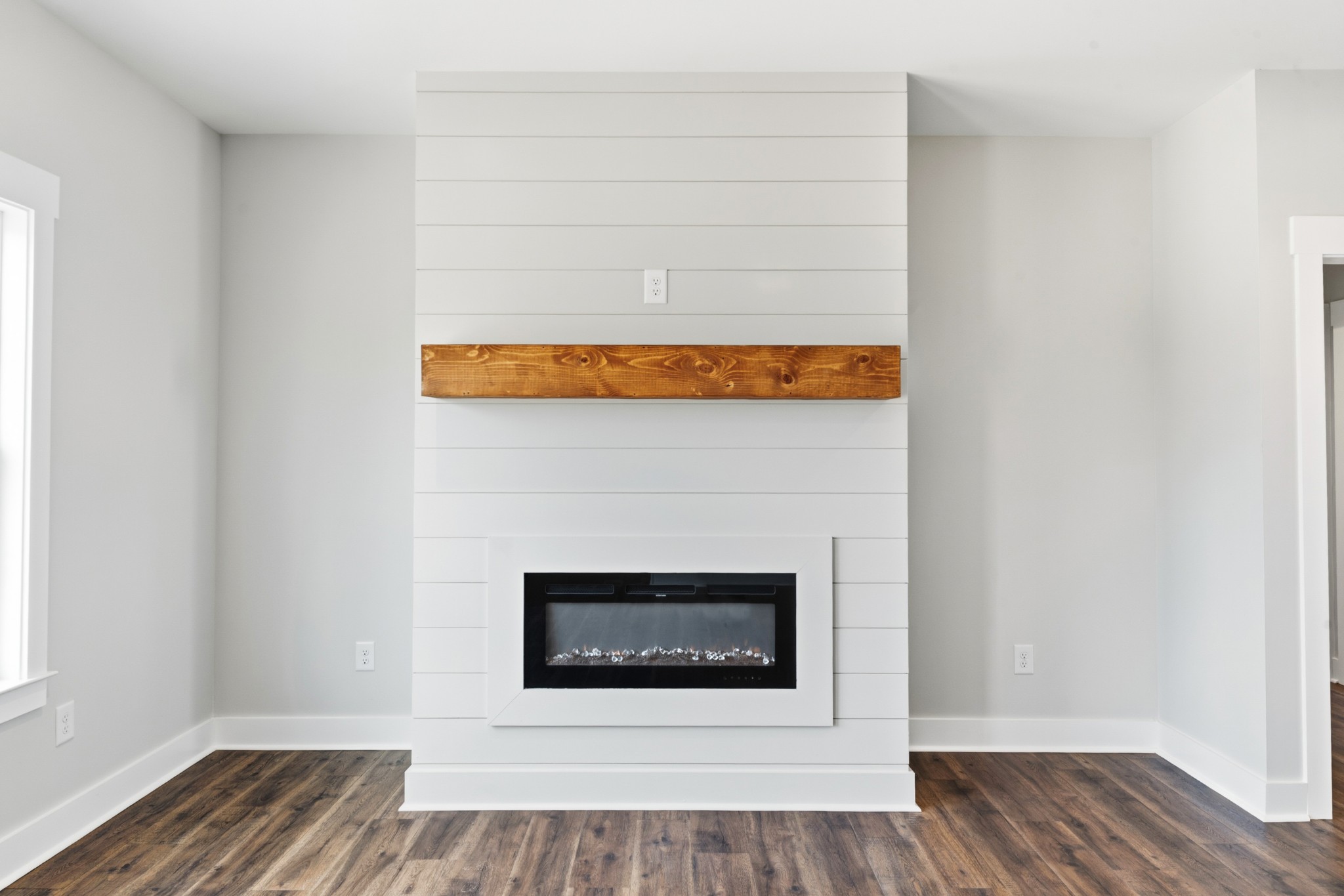 338 Dugout Road Summertown, TN 38483 - Photo 20 of 75 a living room with a fireplace and wooden floor