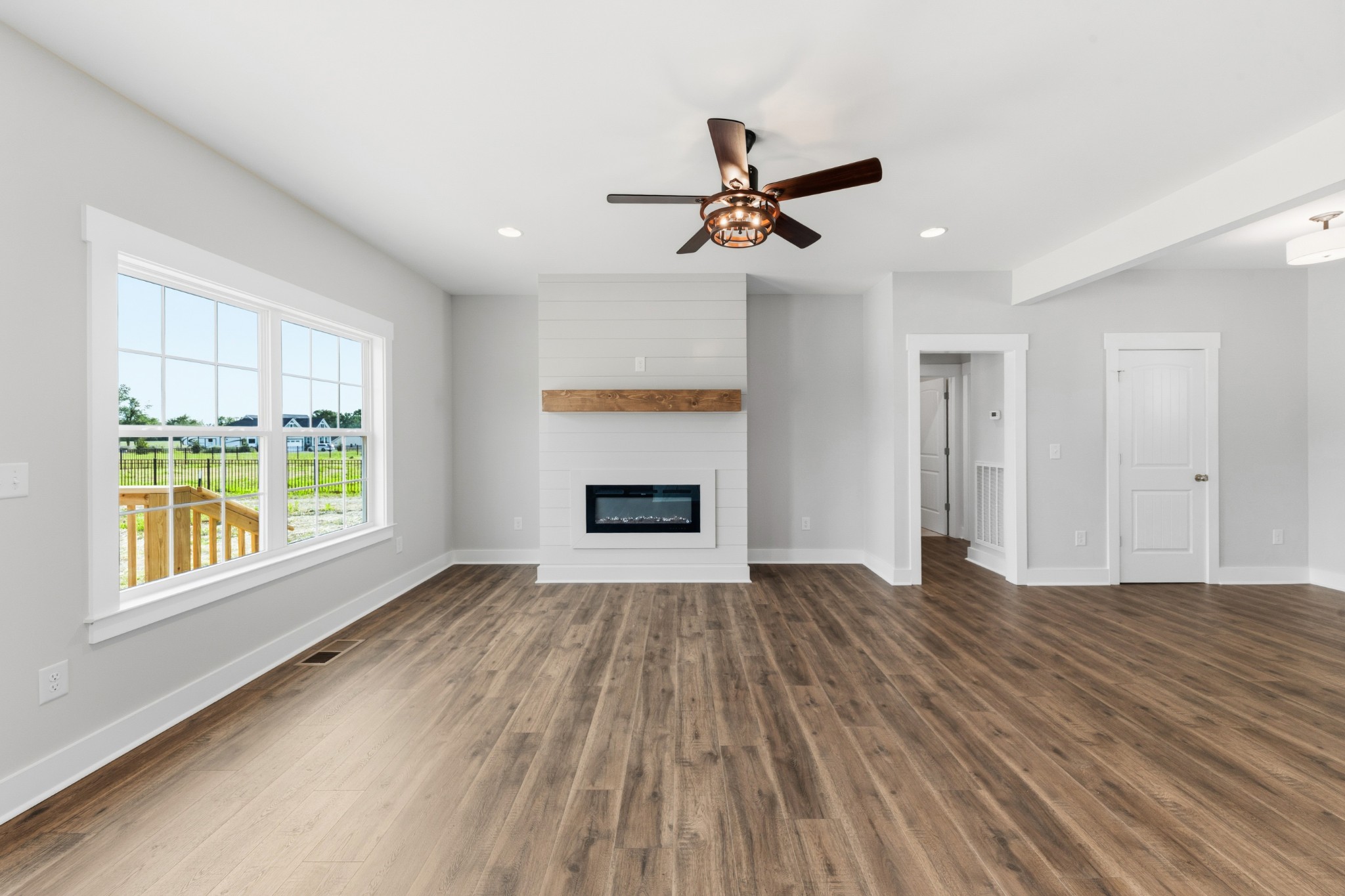 338 Dugout Road Summertown, TN 38483 - Photo 22 of 75 wooden floor in an empty room with a window