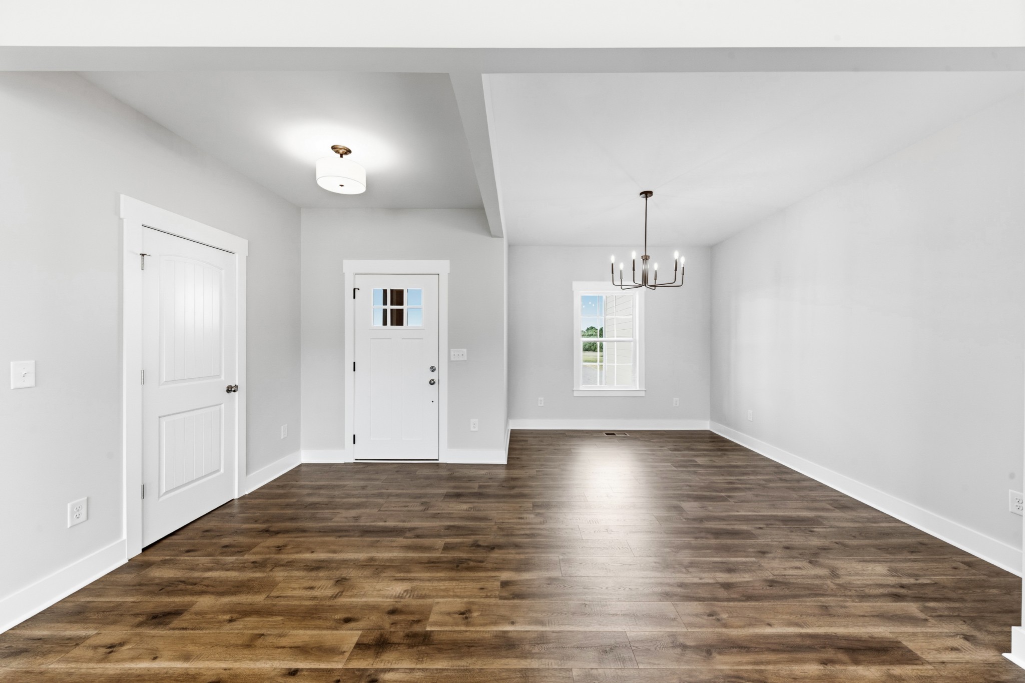 338 Dugout Road Summertown, TN 38483 - Photo 39 of 75 a view of an empty room with window and wooden floor