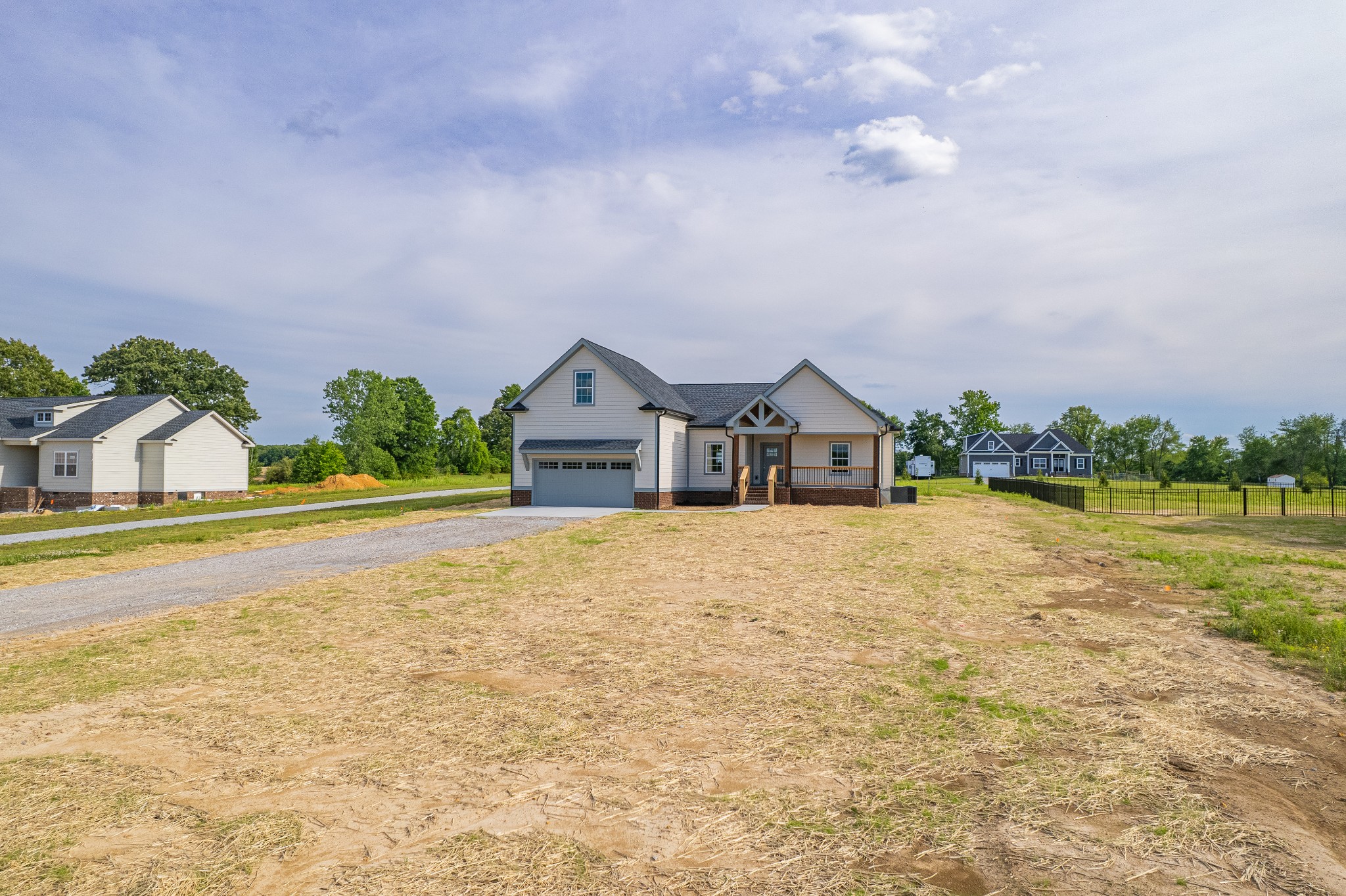 338 Dugout Road Summertown, TN 38483 - Photo 6 of 75 a front view of a house with a yard and garage