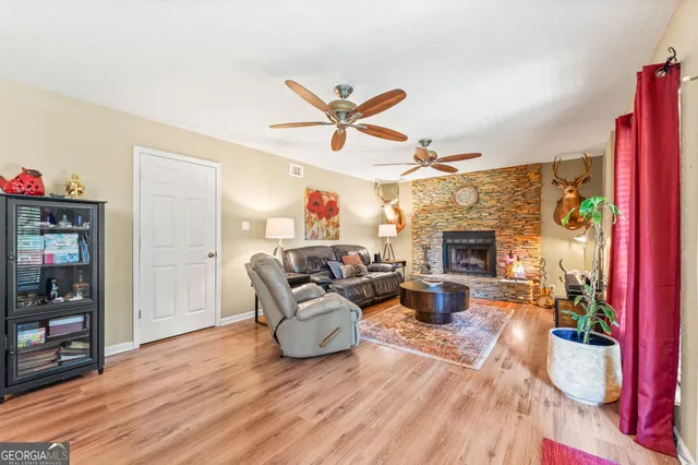 a living room with furniture and a fireplace